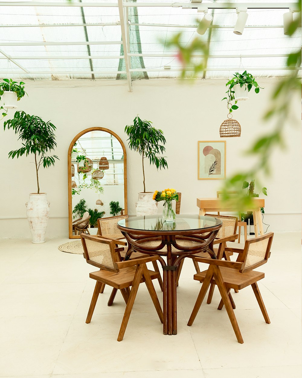 Bright dining space with plants and warm wood furniture